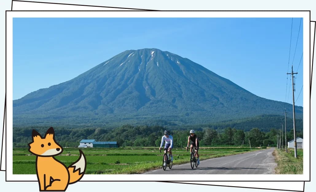 羊蹄山を望む丘に立つ人々